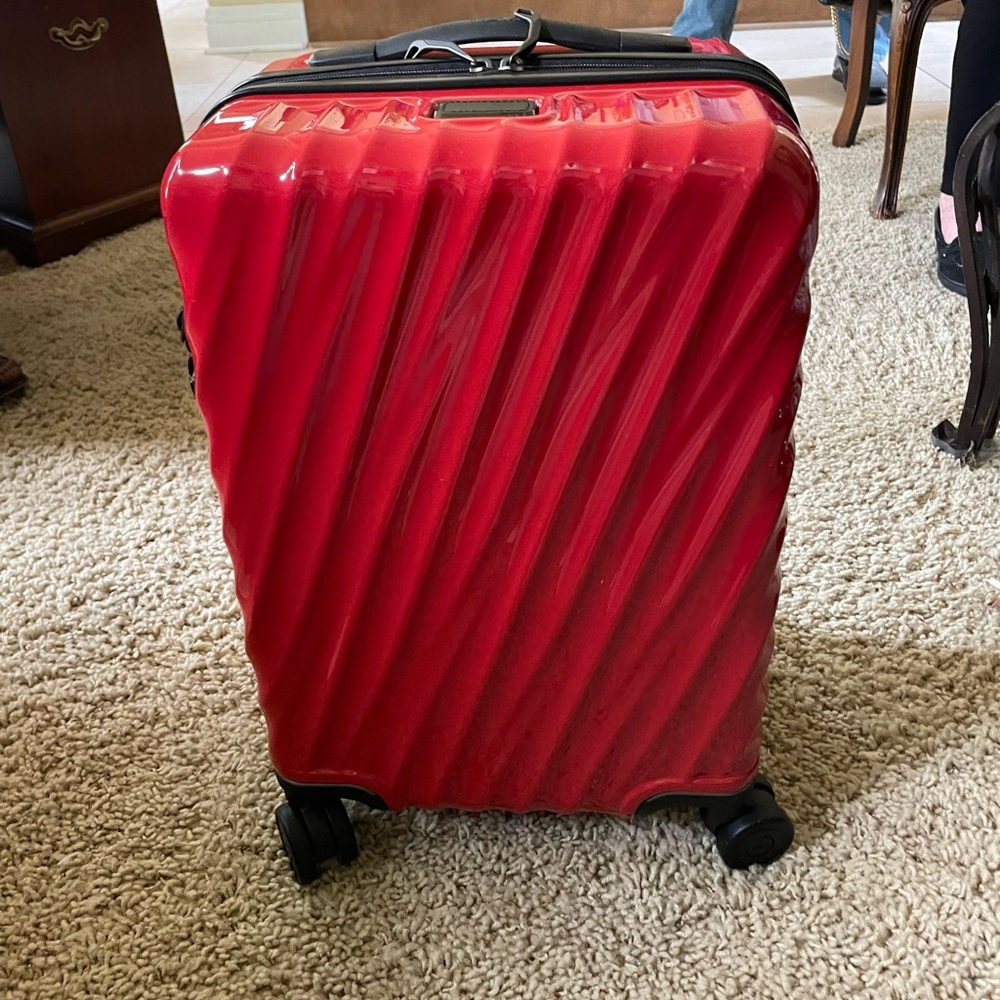 Tumi red suitcase- brand new
